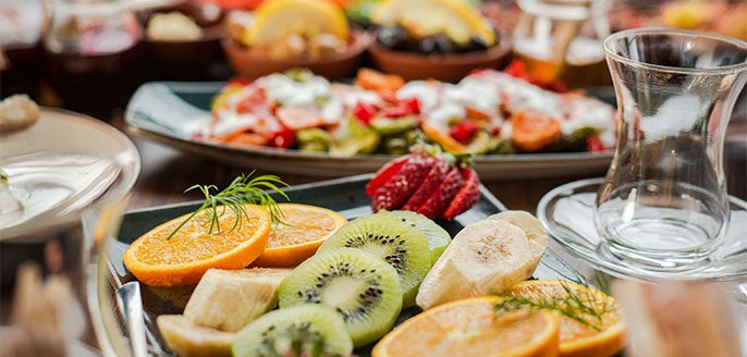 Family style brunch with eggs, breads, preserves, salads