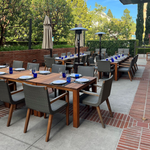 Plateia North Patio with tables, chairs, and place settings